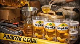 Petugas kepolisian melakukan pengecekan terhadap kemasan minyak goreng bermerek Minyak Kita yang diduga dikemas ulang dari minyak curah di Kabupaten Pamekasan, Jawa Timur.